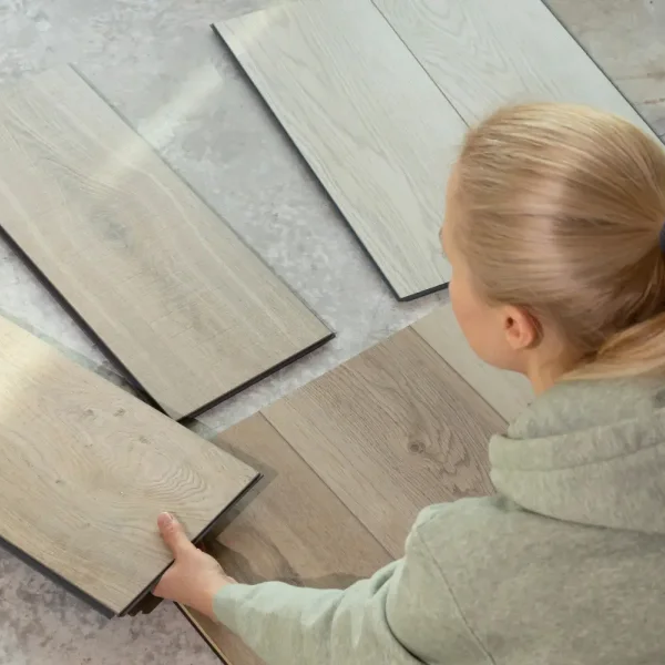 Home owner looking at eco-friendly flooring samples